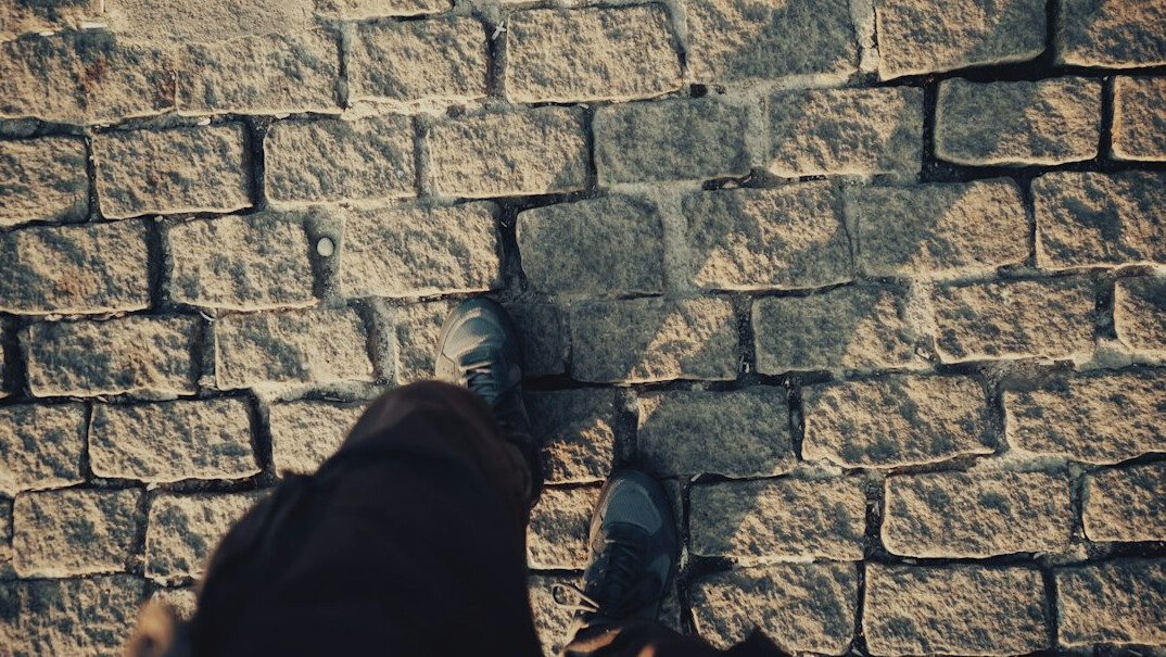 person breaking through wall