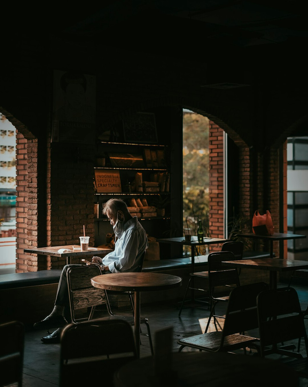 person journaling in cafe